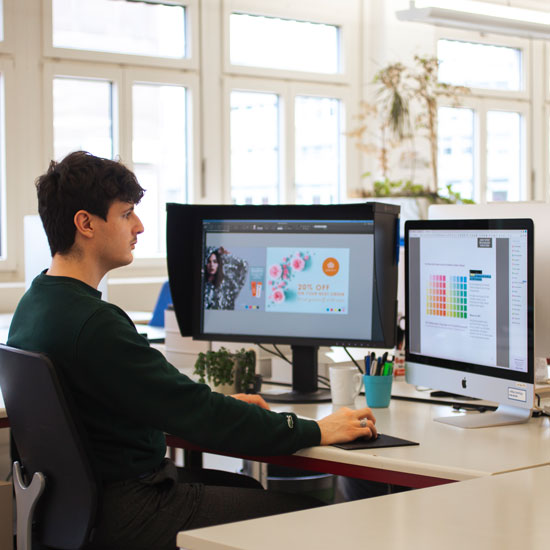 Man working on screens