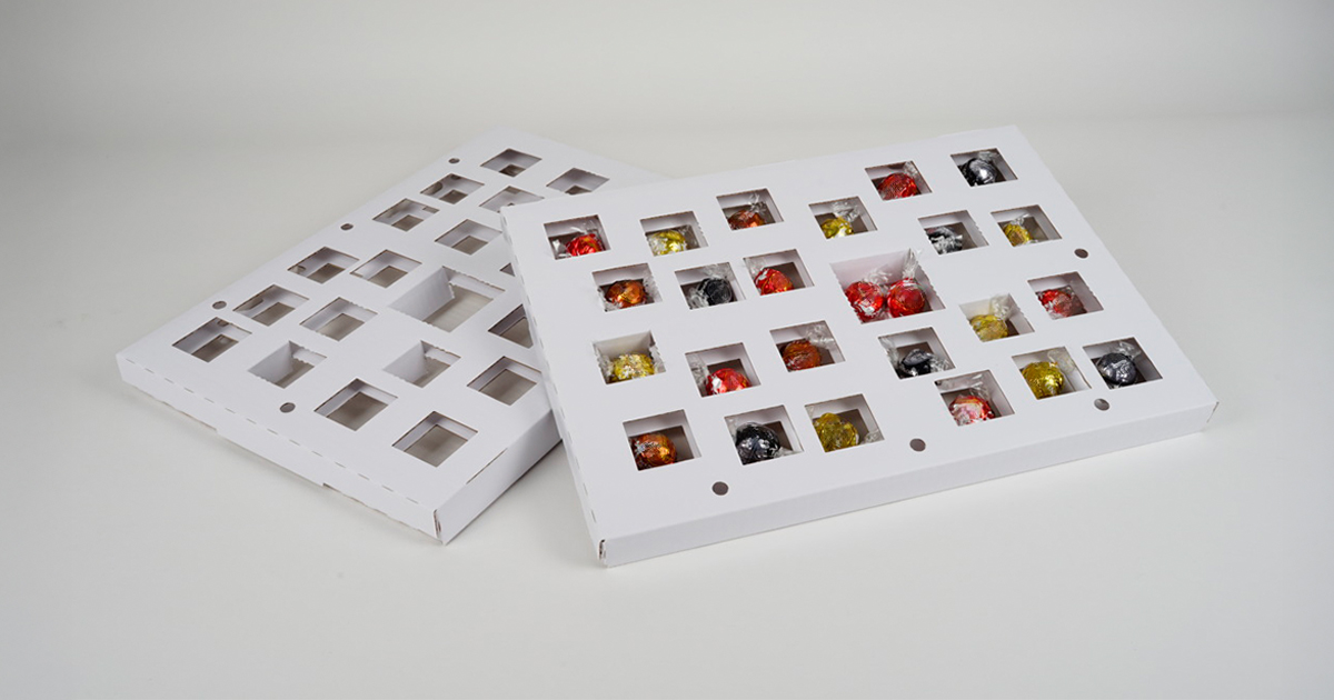 Kartoninlay für Adventskalenderpackung.